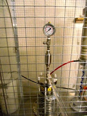 Floating gas cylinder with gauge and needle valve.