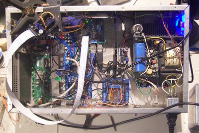 In real life, this has a copper plate screwed over the big hole, ferrites on the ethernet cables to the other pis, and so on and so forth.  Fiber to my LAN for galvanic isolation.