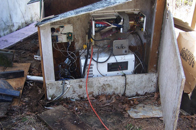 The upper inverter only runs my 5hp air compressor and can serve as a charger in an emergency - all the backups have backups.