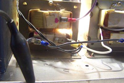 Light showing through where a shunt used to be.  The transormer on the right needed 3 more turns on the primary to have the same effective turns ratio under load.