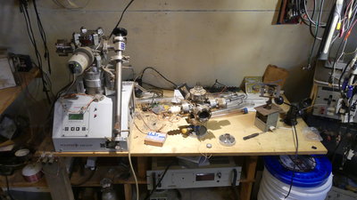 The cross is sitting down on the bench.   Lots of adapters and goodies on there, gas inlet valves, feedthroughs, window, wiggle stick...but no room in there!