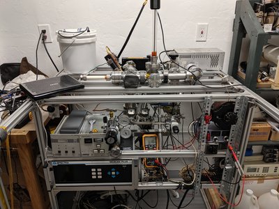 Turbo controllers and RGA power supply in lower left. Deuterium gas and regulator in center. X-ray transformer in the white bucket and Spellman in back right.