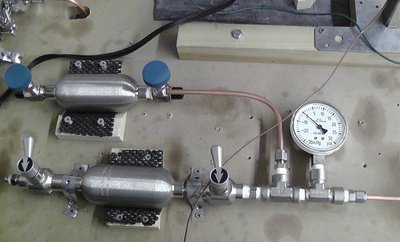 Gas Reservoirs (one for D2, one for any other desired gas), and fill pressure gauge