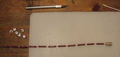 Teflon spacers were added to keep the resistors away from the glass